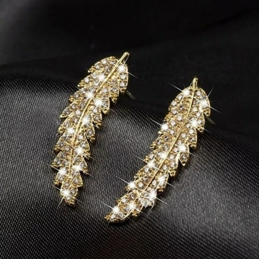 Gold cubic zirconia feather stud earrings